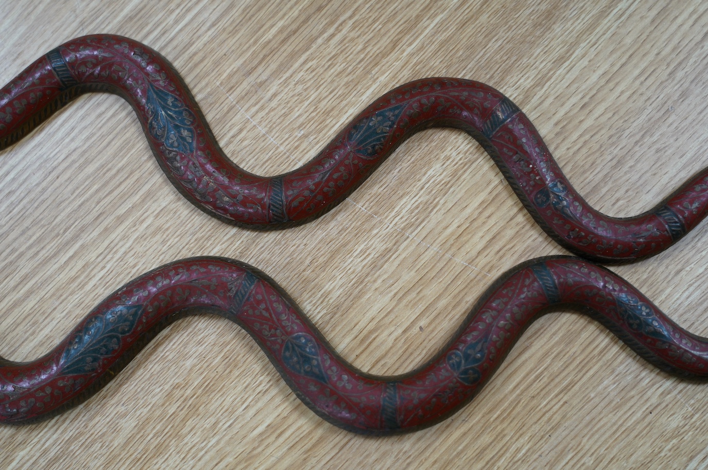 A pair of Indian Benares enamelled brass cobra wall sconces, 79cm high. Condition - lower end of tail on one chipped